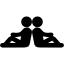 Two persons sitting back with back in symmetrical posture